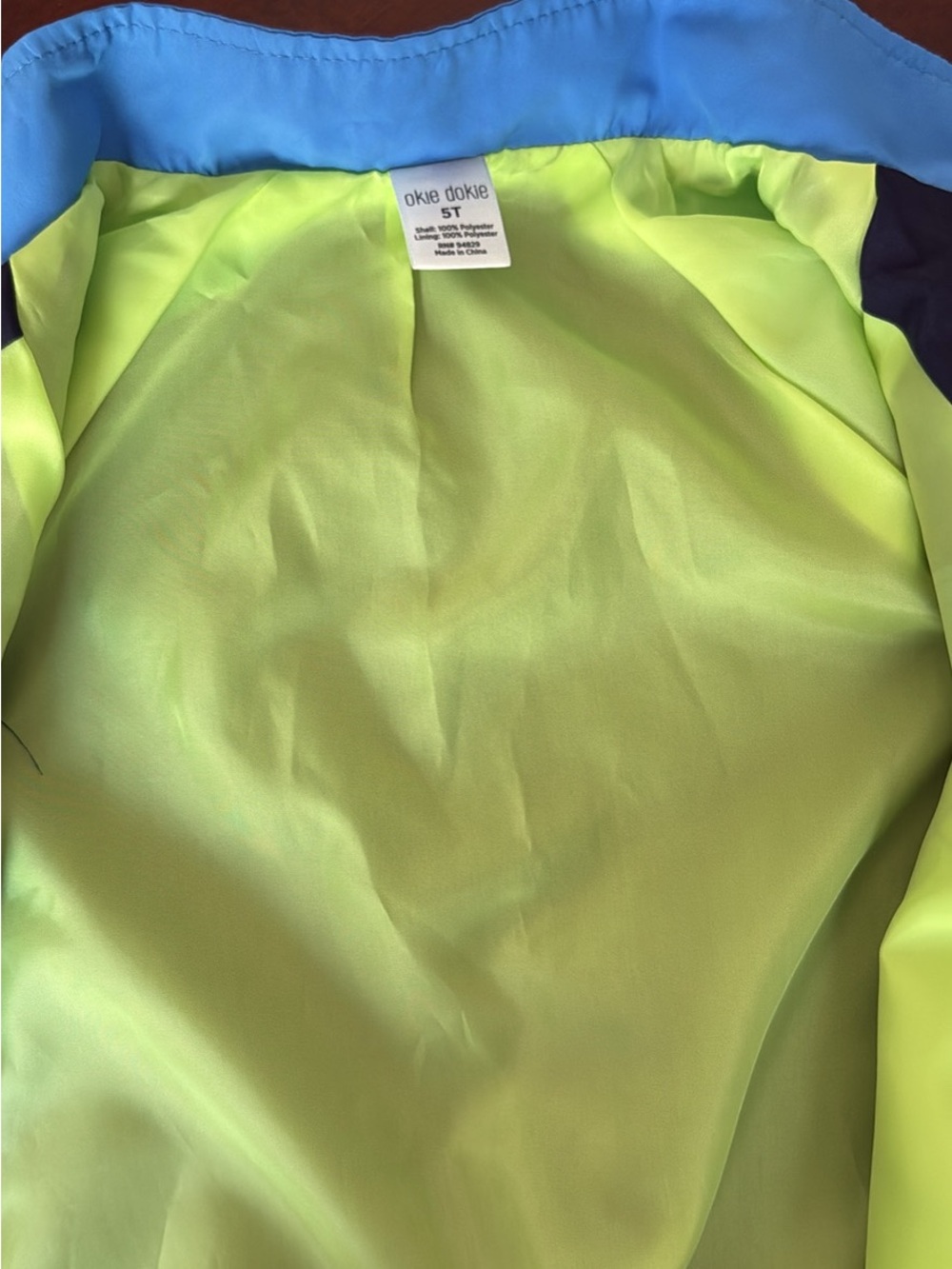 okie dokie child’s Neon Lime Jacket with Blue Trim. 5T